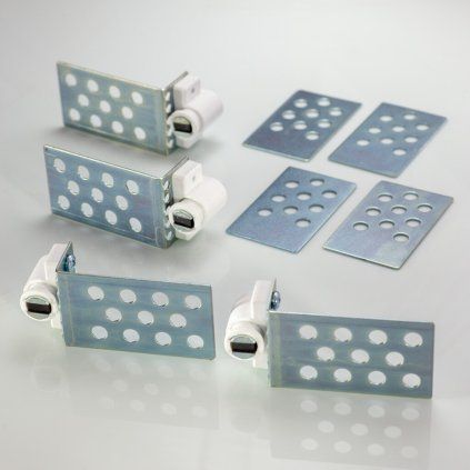 Set of ferrite magnets and anchoring plates for a tiled access opening