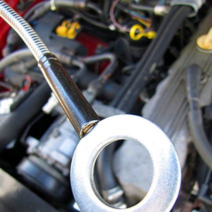 Flexible automotive magnetic pick-up tool with a retractable magnetic tip