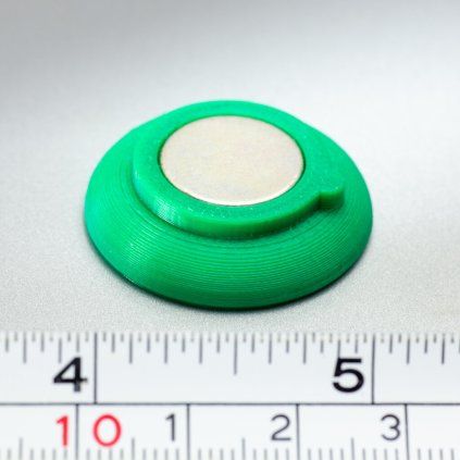 Large green neodymium magnet in a plastic case